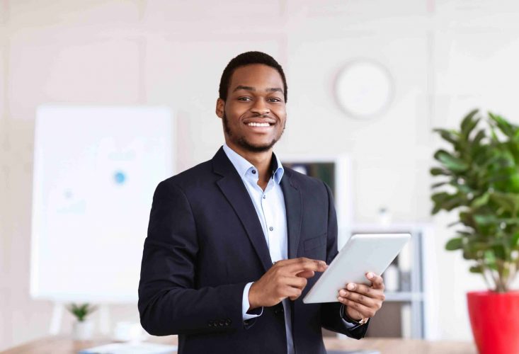 Advisor from an IMO or BGA looking hat Hexure's life insurance and annuity software on an iPad