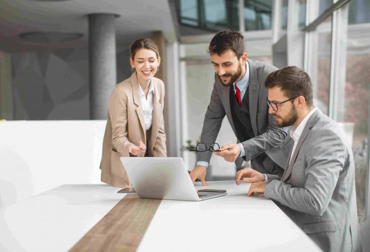 Financial professionals from a financial institution looking at life and annuity software